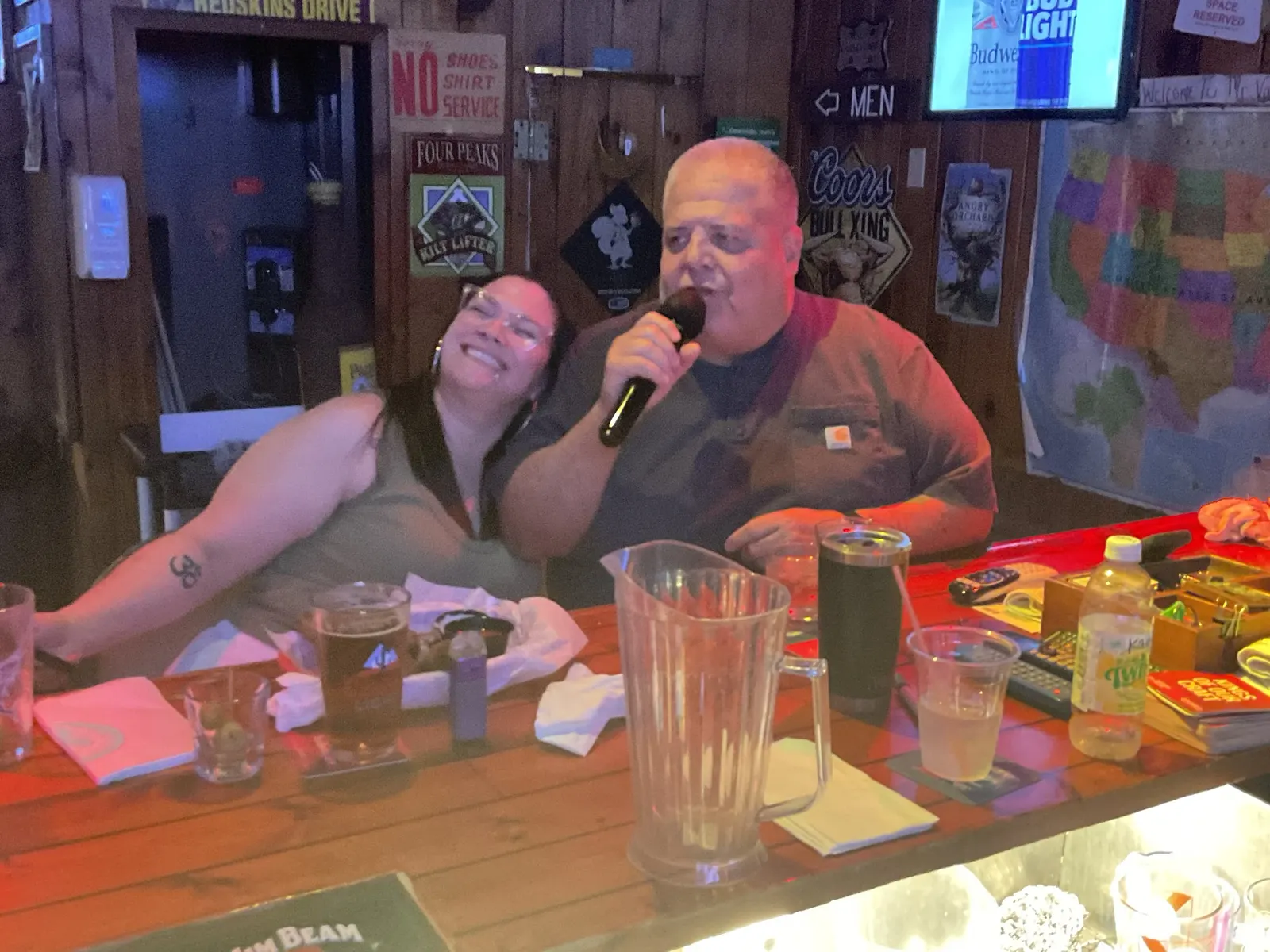 Karaoke duet performing at the bar