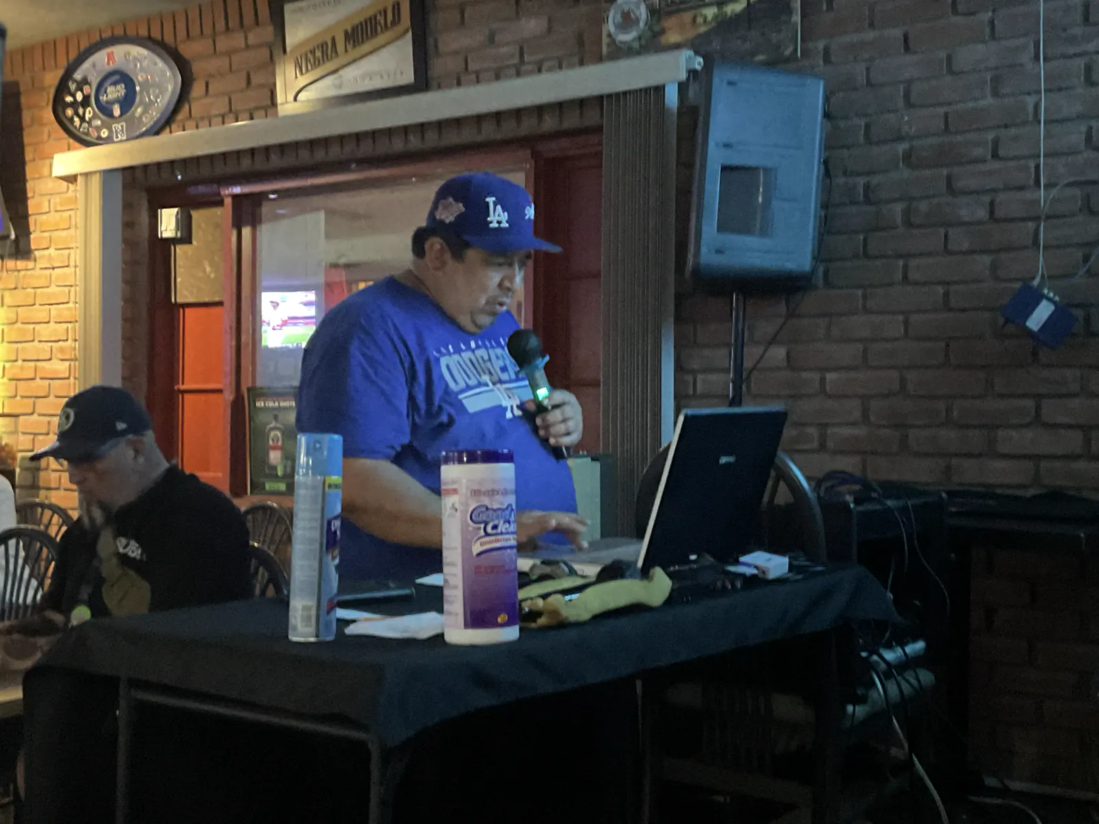 Singer and friend enjoying karaoke night