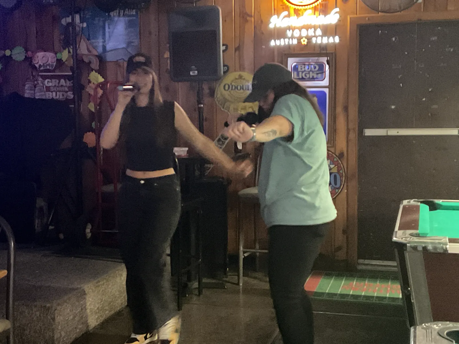 Karaoke singer performing at the Wooden Nickel